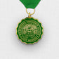 Gold and green award medal with a ribbon